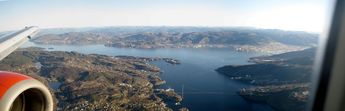 Askøy to the left, Bergen to the right, as seen from the plane just before landing.
© 2008 Knut Dalen
